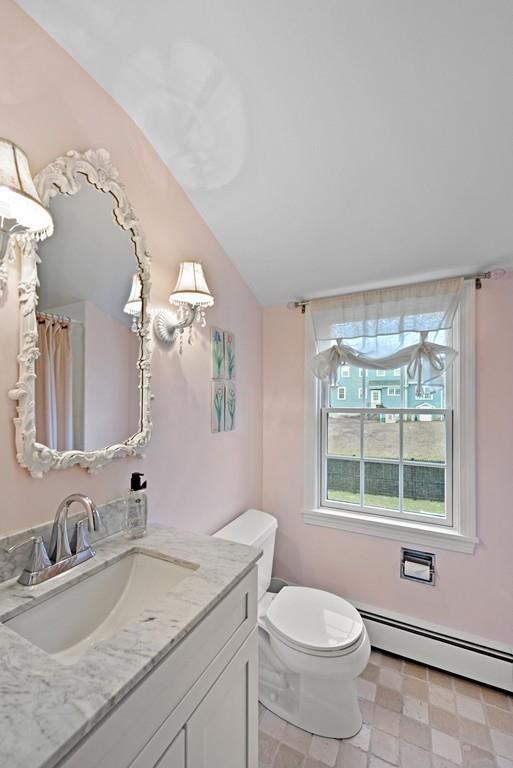 12 Hawthorn Road Marblehead, MA 01945 - Photo 21 of 35 a bathroom with a granite countertop sink mirror vanity and toilet