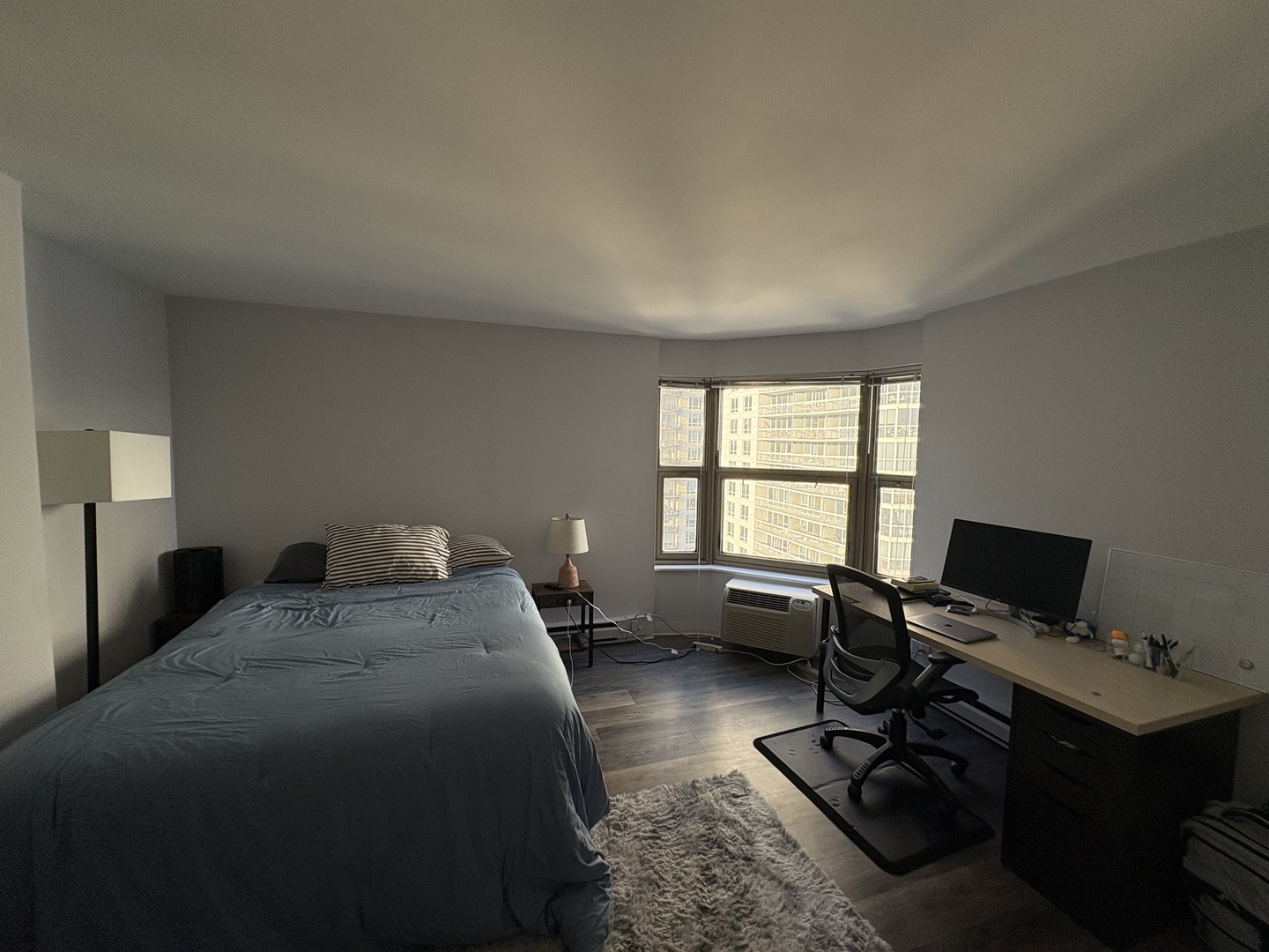 8 West Chestnut Street, Unit 21F Chicago, IL 60610 - Photo 14 of 19 a bedroom with a bed computer on desk and a window