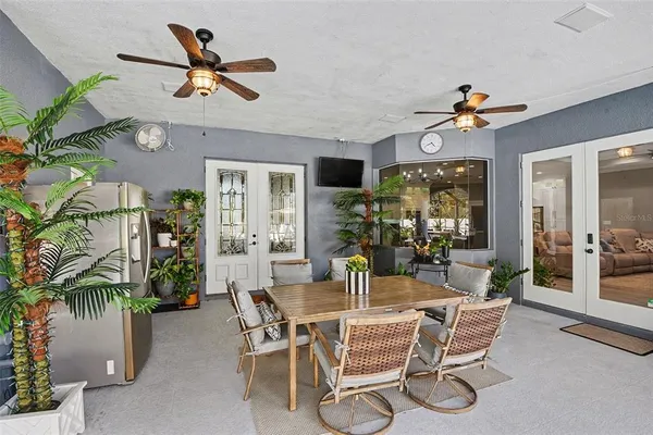 a view of a backyard with a patio and fire pit