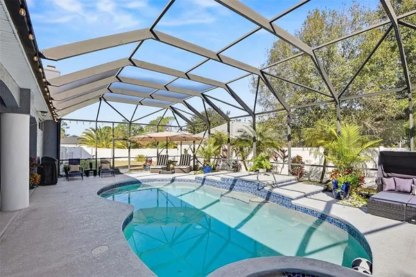 a view of a swimming pool with a patio