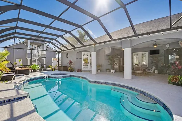 a view of a swimming pool with a patio