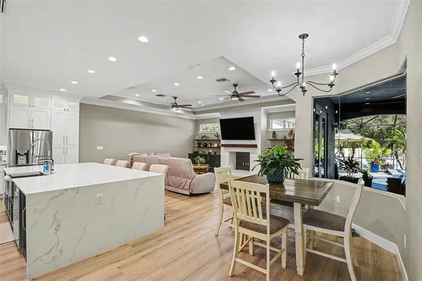 a large kitchen with a table and chairs