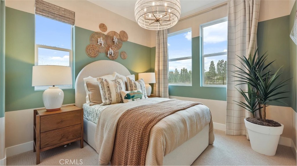 1829 Lychee Street Fullerton, CA 92833 - Photo 16 of 23 a bedroom with a bed and a chandelier