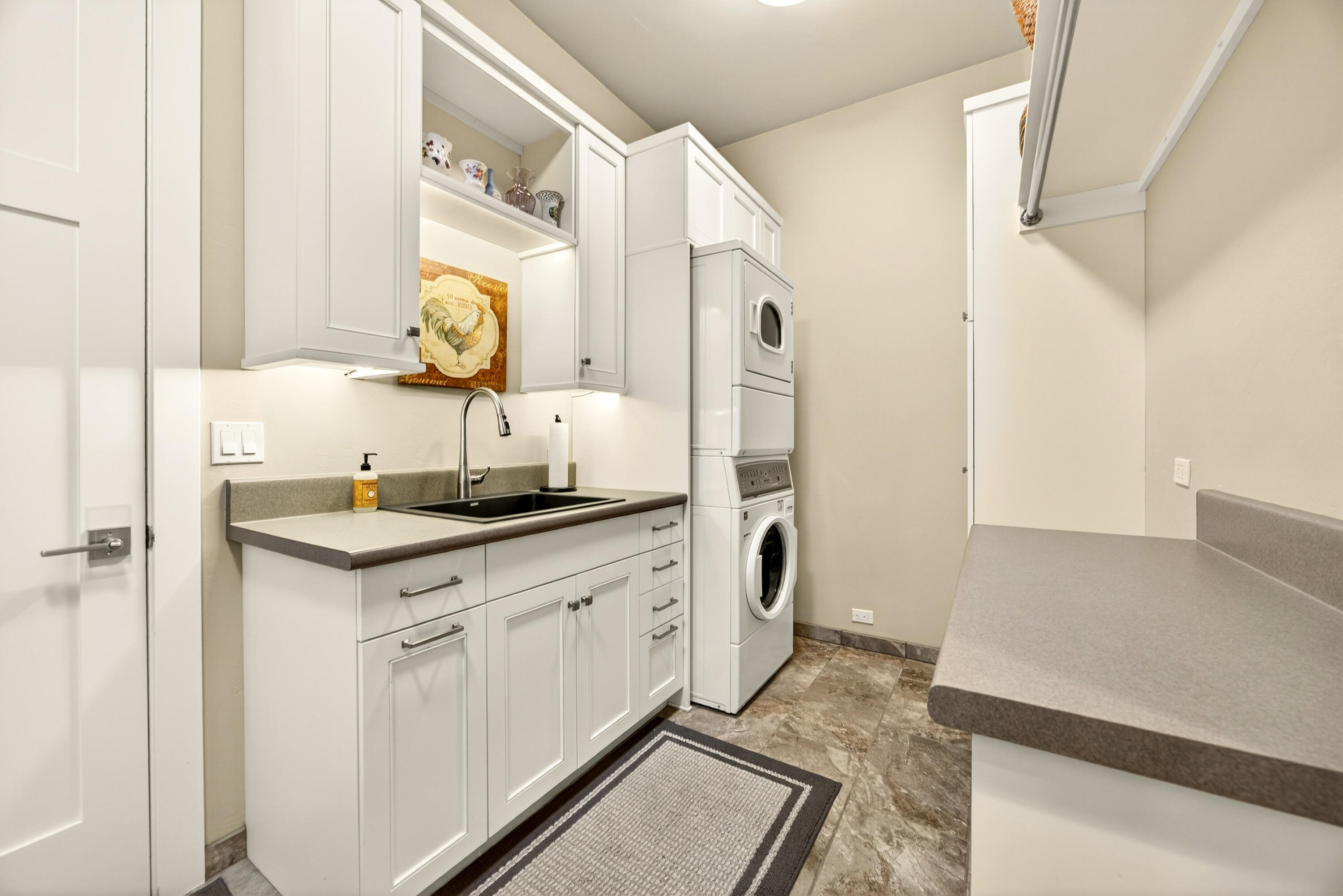 930 Granite Ridge Circle Jacksonville, OR 97530 - Photo 32 of 79 Spacious laundry room w/ lots of storage and deep sink.
