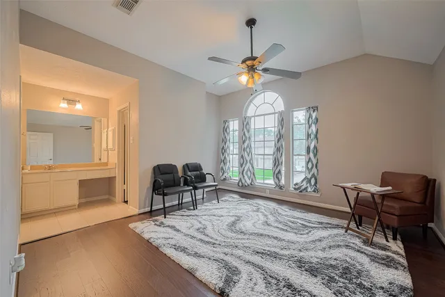 a bedroom with a bed and a chair