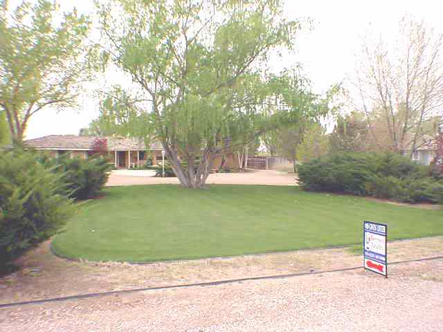 3213 Alcorn Road, Unit E1 Fallon, NV 89406 - Photo 1 of 8 a view of a park with large trees