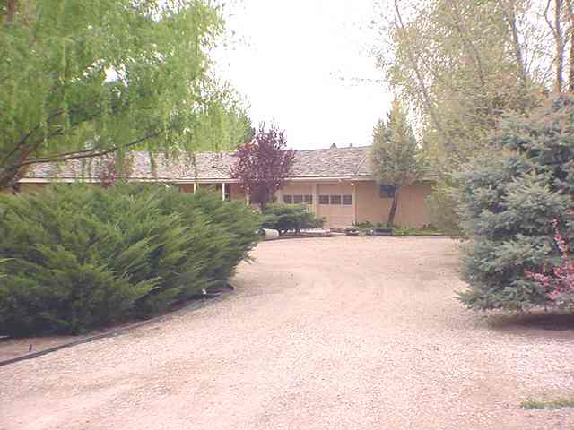 3213 Alcorn Road, Unit E1 Fallon, NV 89406 - Photo 2 of 8 a view of a house with a yard and pathway