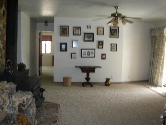 3213 Alcorn Road, Unit E1 Fallon, NV 89406 - Photo 3 of 8 a living room with furniture and a window