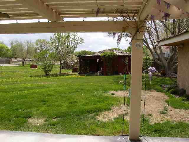 3213 Alcorn Road, Unit E1 Fallon, NV 89406 - Photo 7 of 8 a view of a house with a yard