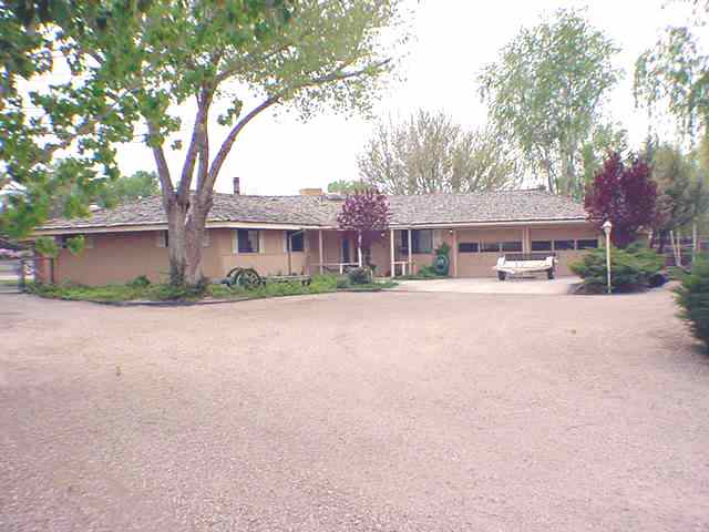 3213 Alcorn Road, Unit E1 Fallon, NV 89406 - Photo 8 of 8 a front view of a house with a yard