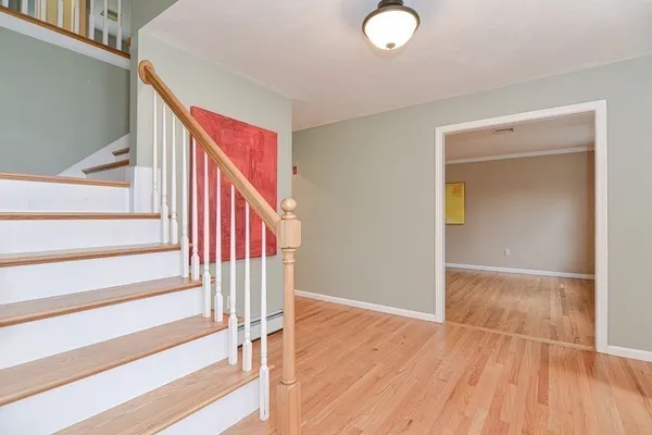 a view of entryway with wooden floor