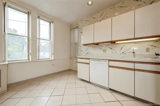 a bathroom with a sink vanity and mirror