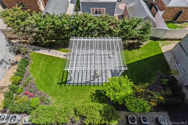 a view of building with garden space and street view