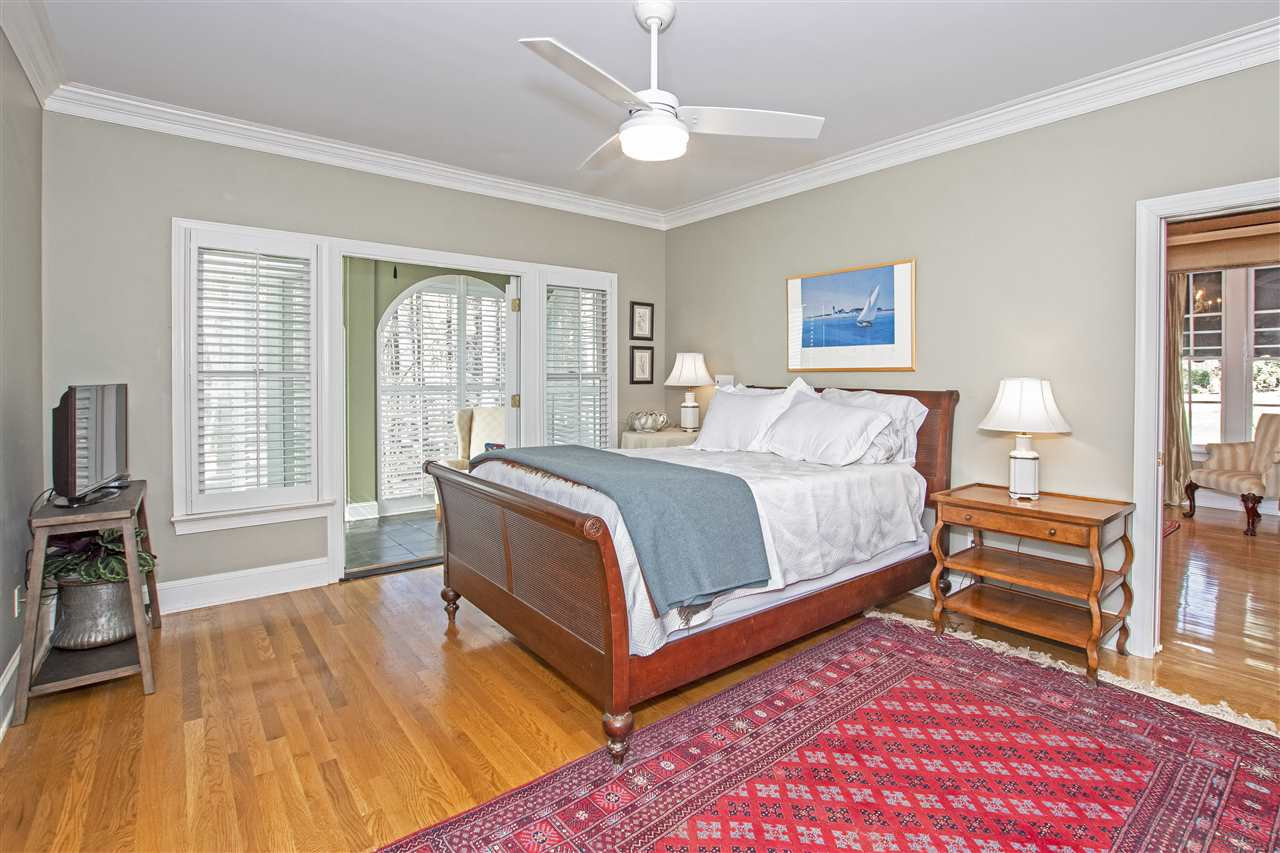 5817 Laurel Rock Lane Raleigh, NC 27613 - Photo 12 of 30 Large master bedroom on main floor with lovely sunroom, and huge master bathroom! Master bedroom also had direct access to the downstairs study/office/formal sitting room. Master Bedroom with Sunroom