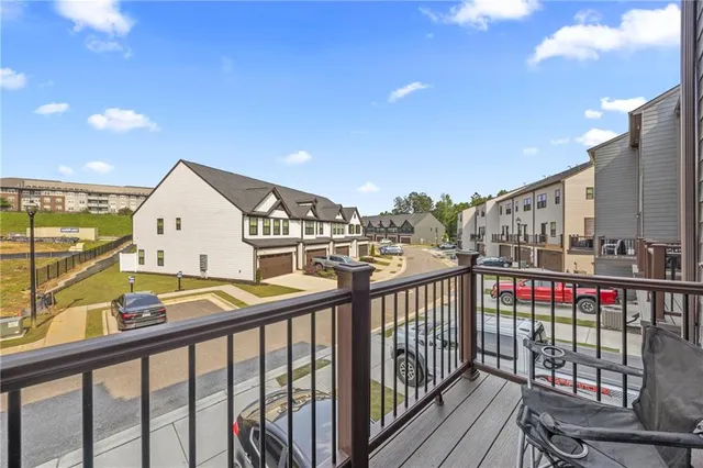 a view of a balcony with furniture