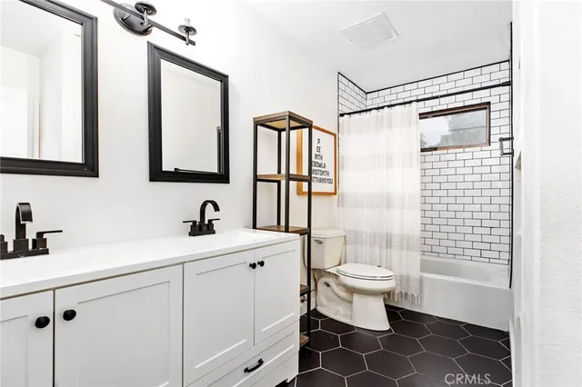 a living room with a large window and outer view