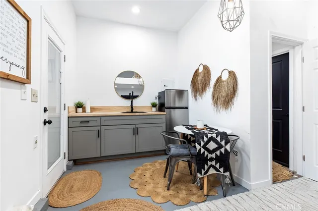 a kitchen with a stove and a refrigerator