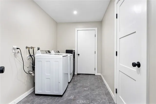 a kitchen with stainless steel appliances a refrigerator and wooden floor