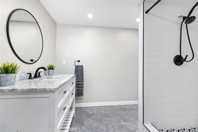 a kitchen with stainless steel appliances white cabinets and a stove a sink