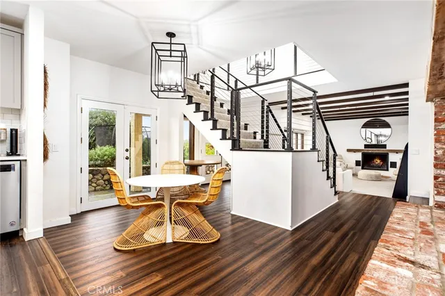 a view of a chairs and table in a backyard