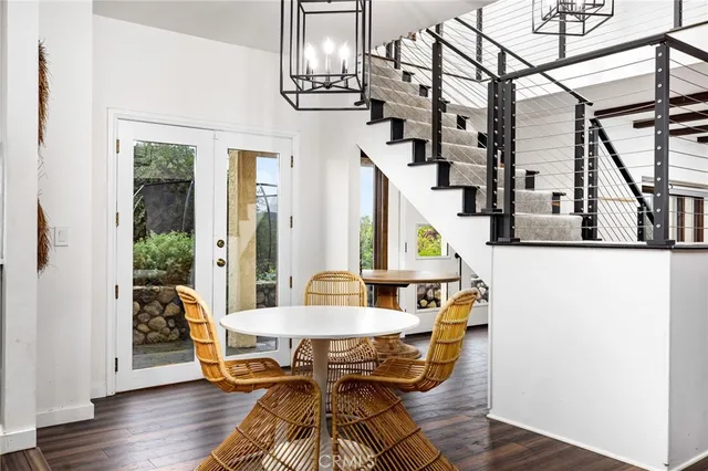 an aerial view of a house with a yard basket ball court and outdoor seating
