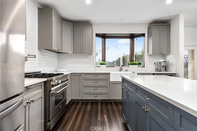 a view of a patio with table and chairs and potted plants