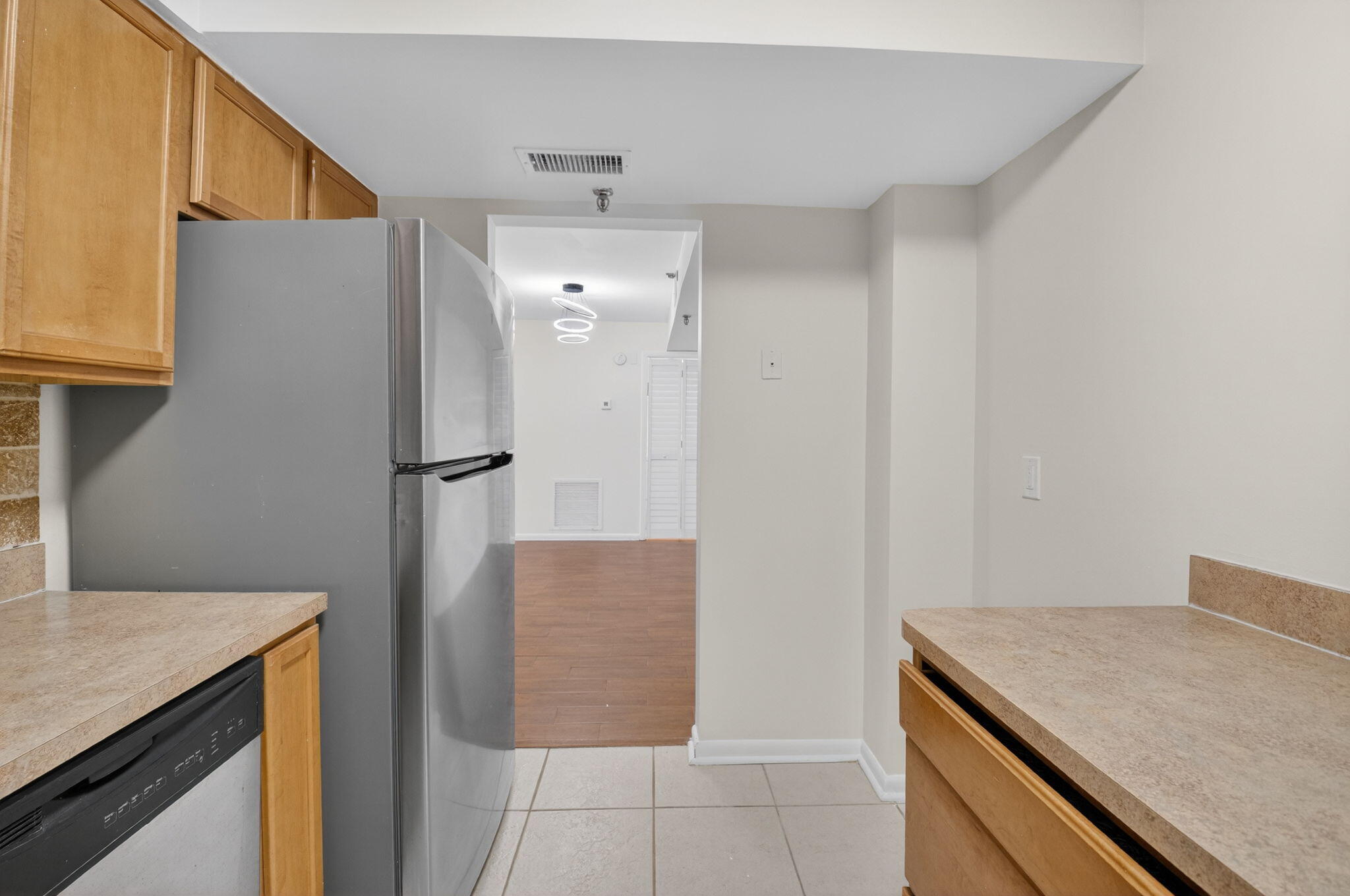 5260 Northwest 2nd Avenue, Unit 206 Boca Raton, FL 33487 - Photo 14 of 36 a kitchen with stainless steel appliances granite countertop a refrigerator and a sink