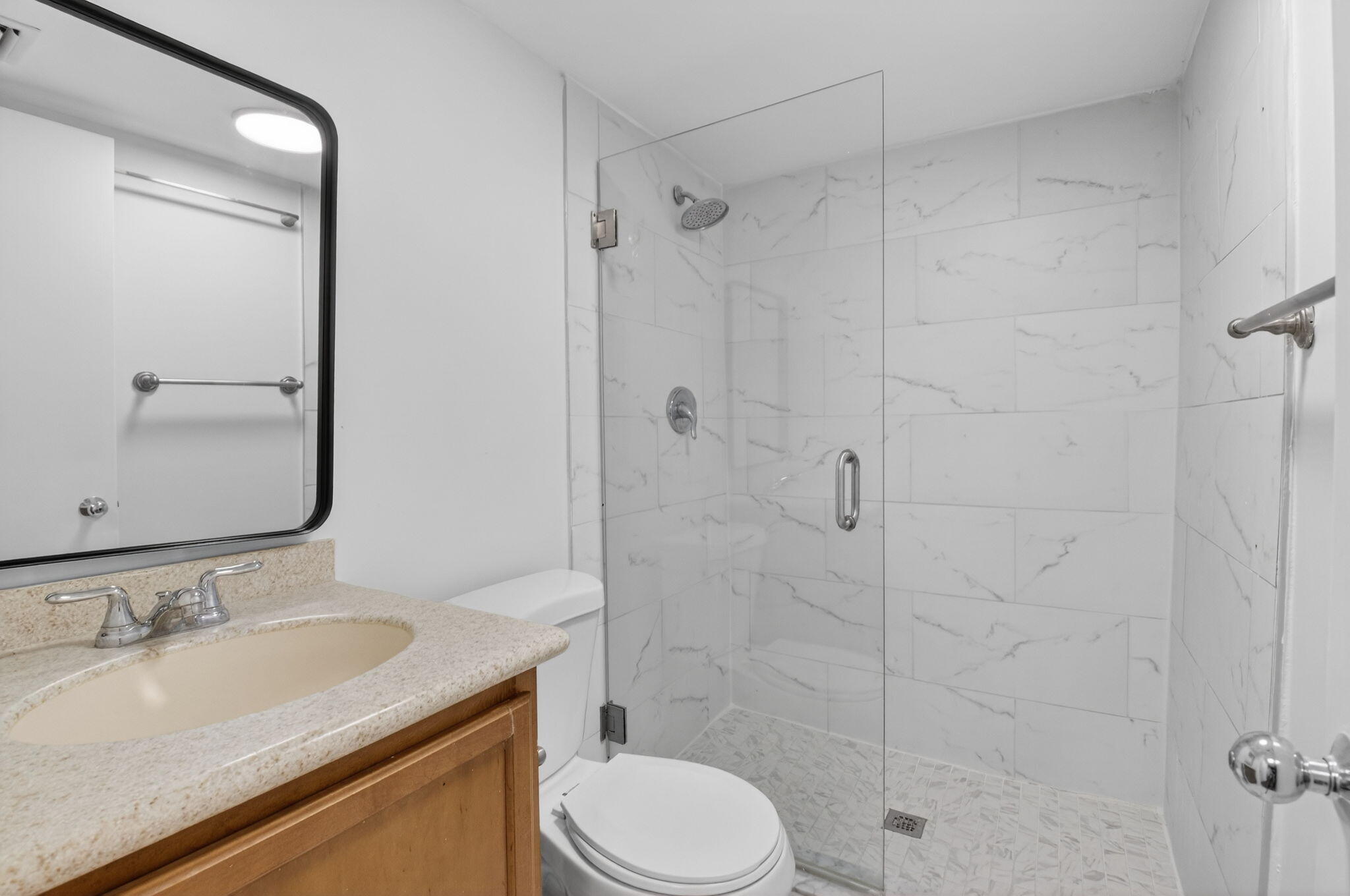 5260 Northwest 2nd Avenue, Unit 206 Boca Raton, FL 33487 - Photo 16 of 36 a bathroom with a granite countertop sink toilet and shower