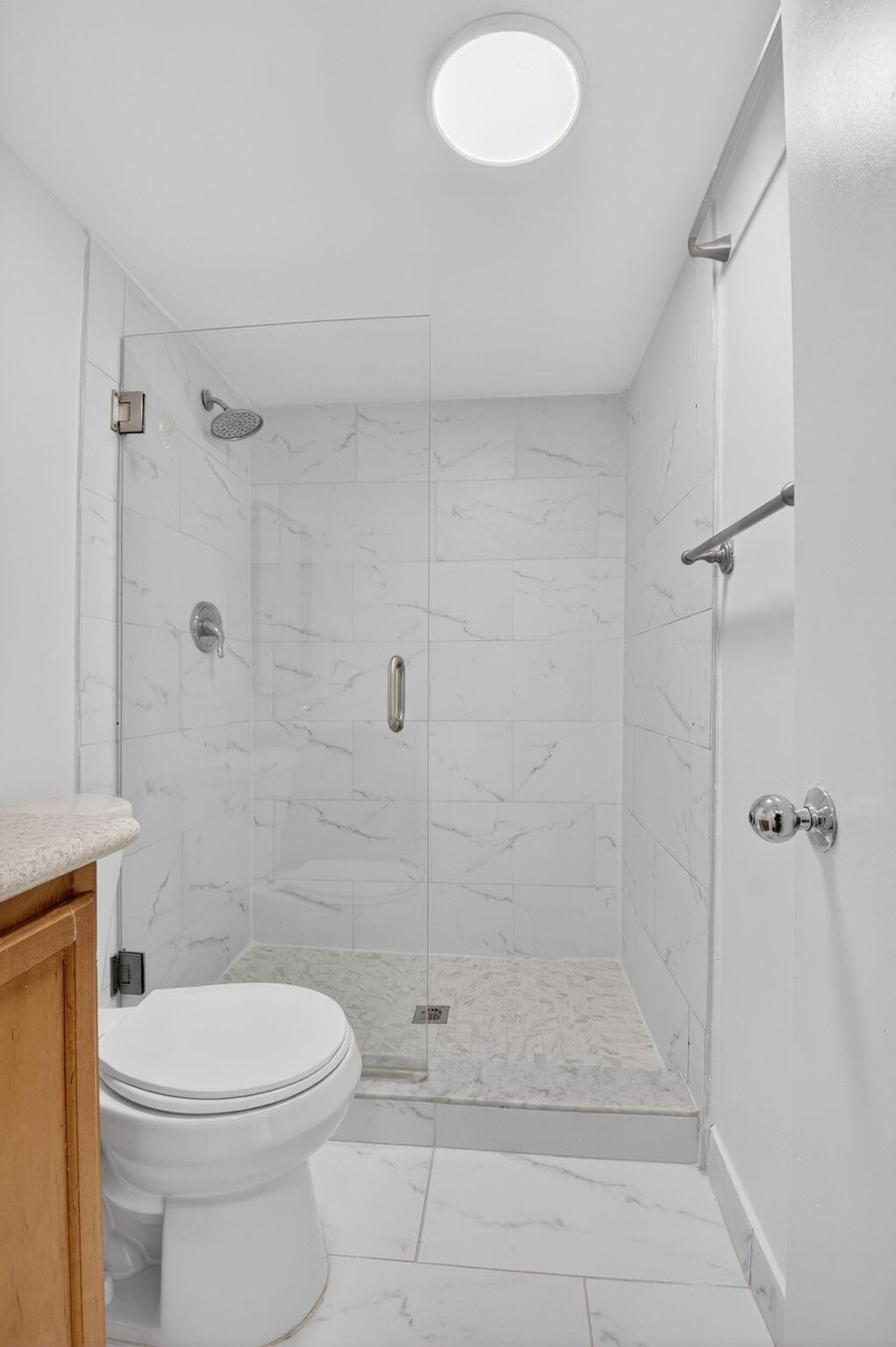 5260 Northwest 2nd Avenue, Unit 206 Boca Raton, FL 33487 - Photo 18 of 36 a bathroom with a shower and a toilet