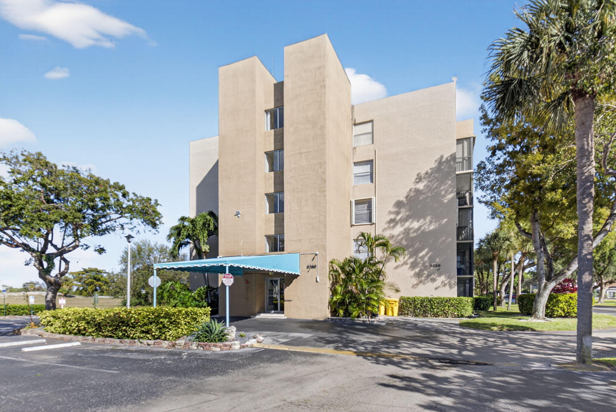 5260 Northwest 2nd Avenue, Unit 206 Boca Raton, FL 33487 - Photo 2 of 36 a street view with tall buildings