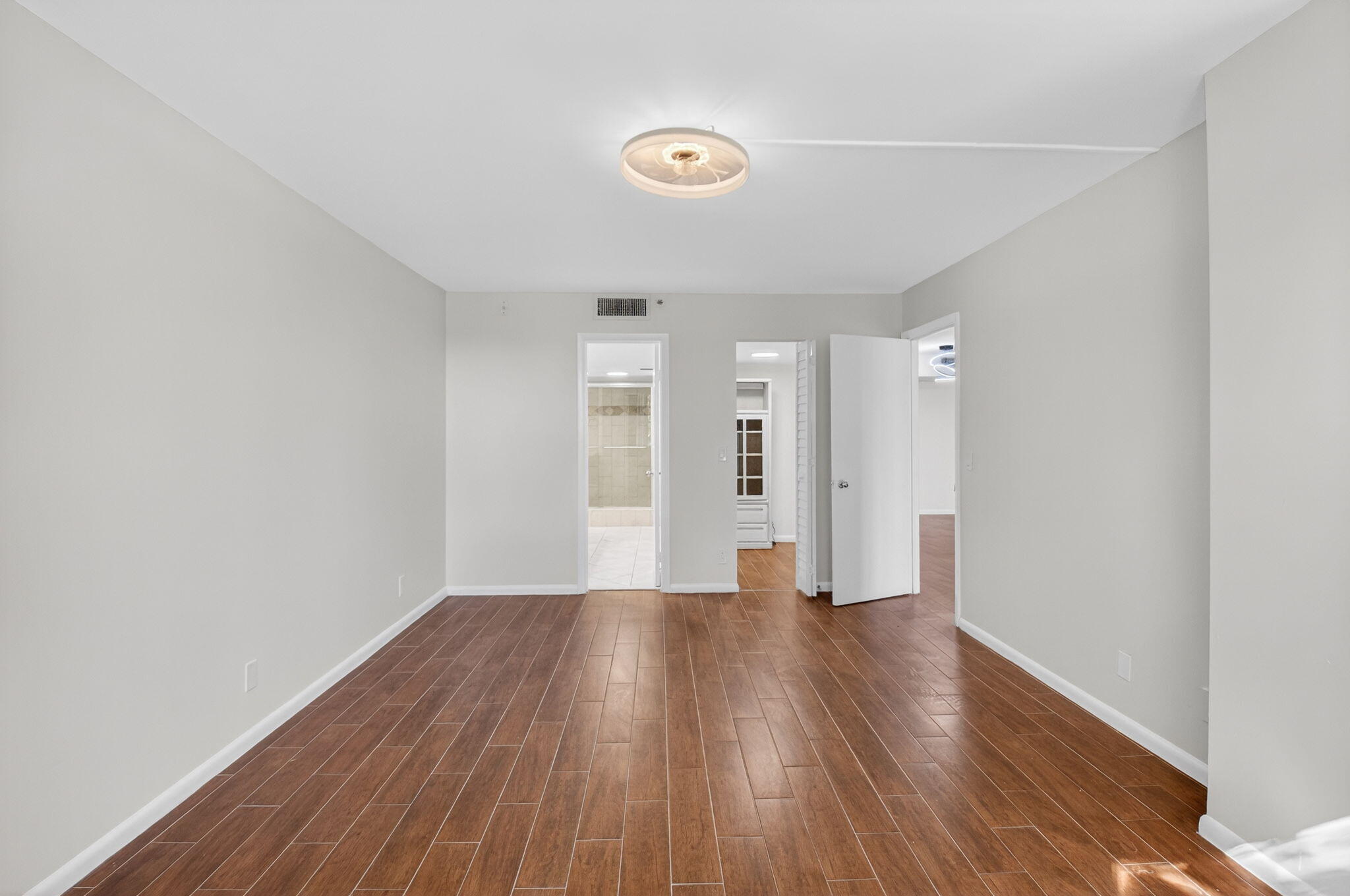 5260 Northwest 2nd Avenue, Unit 206 Boca Raton, FL 33487 - Photo 25 of 36 a view of a livingroom with wooden floor