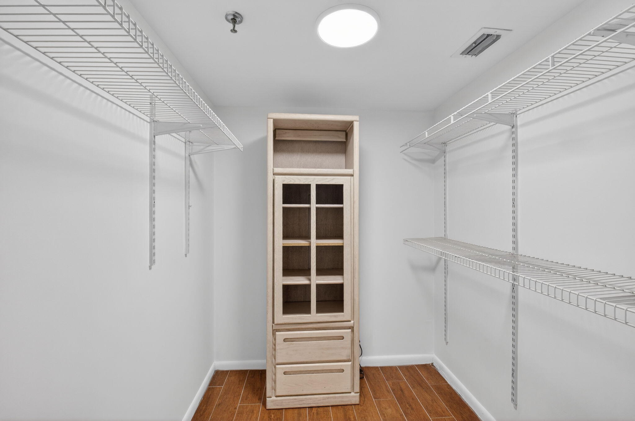 5260 Northwest 2nd Avenue, Unit 206 Boca Raton, FL 33487 - Photo 26 of 36 a view of wooden floor and windows in a room