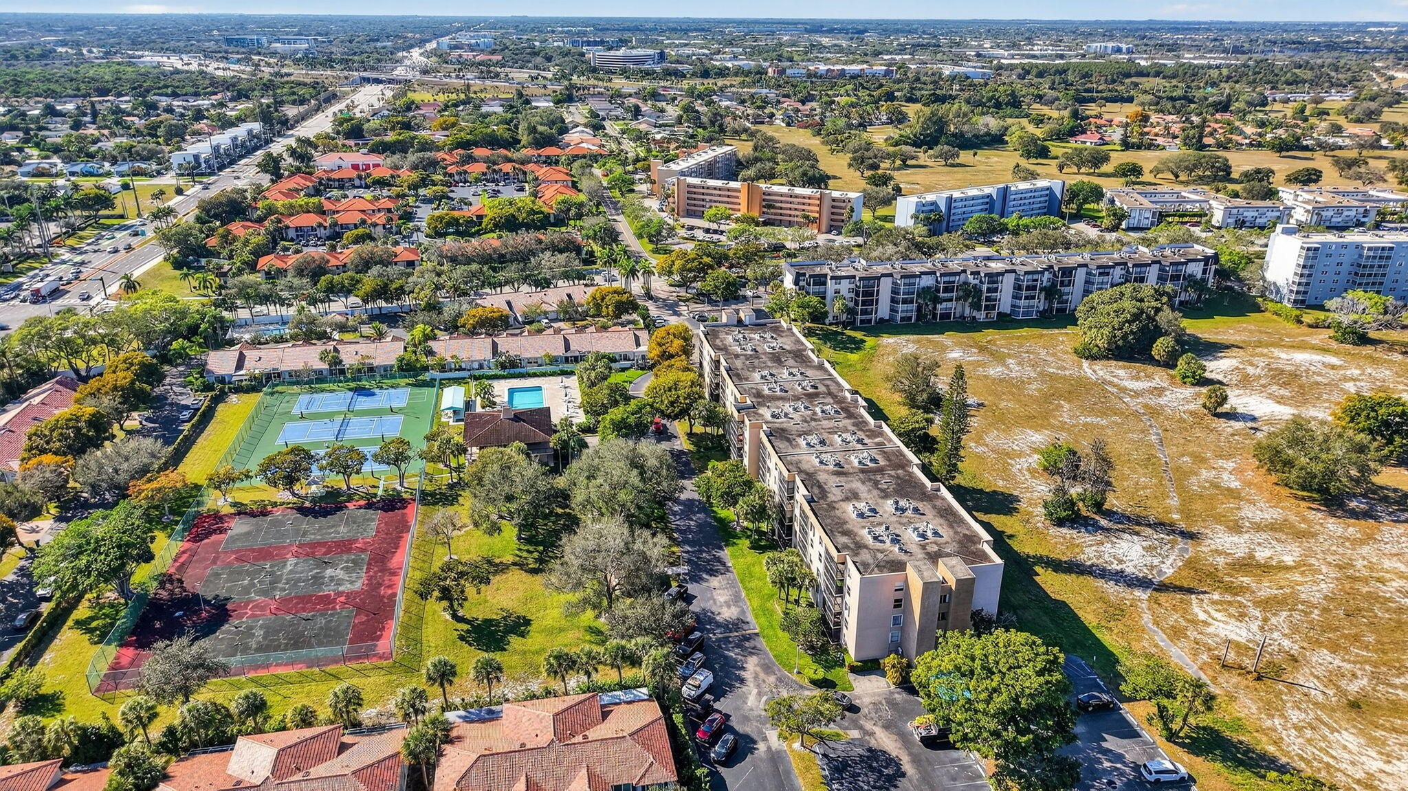 5260 Northwest 2nd Avenue, Unit 206 Boca Raton, FL 33487 - Photo 34 of 36 an aerial view of residential houses with outdoor space