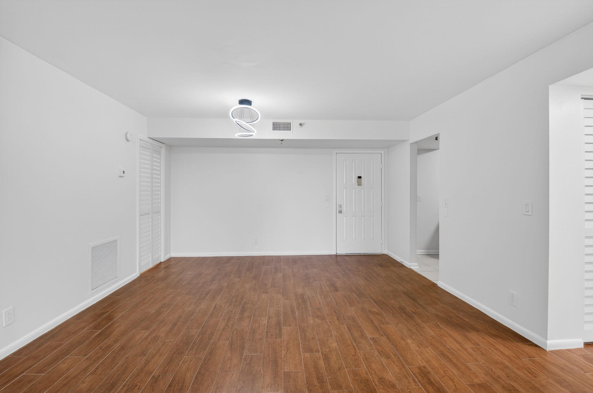5260 Northwest 2nd Avenue, Unit 206 Boca Raton, FL 33487 - Photo 4 of 36 a view of a room with wooden floor and a window