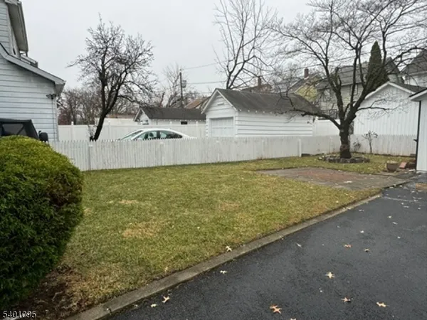 a view of a yard with an house and trees
