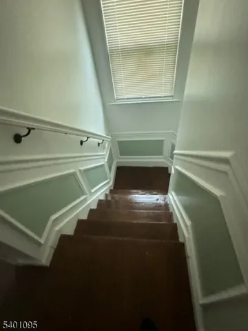 a view of walk in closet with clothes