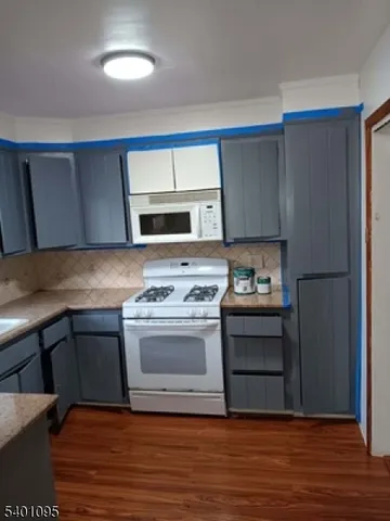 a kitchen with a stove and a refrigerator