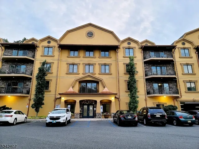 a view of a green yard from a balcony