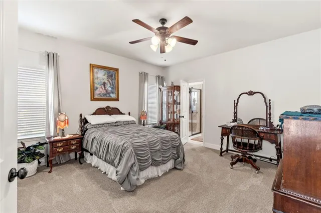 a bedroom with bed and window