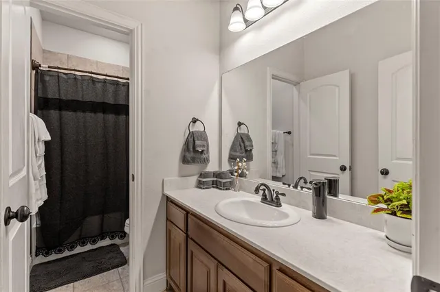 a bathroom with a sink double vanity and a mirror