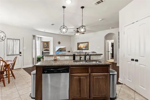 a kitchen with a counter space cabinets and stainless steel appliances