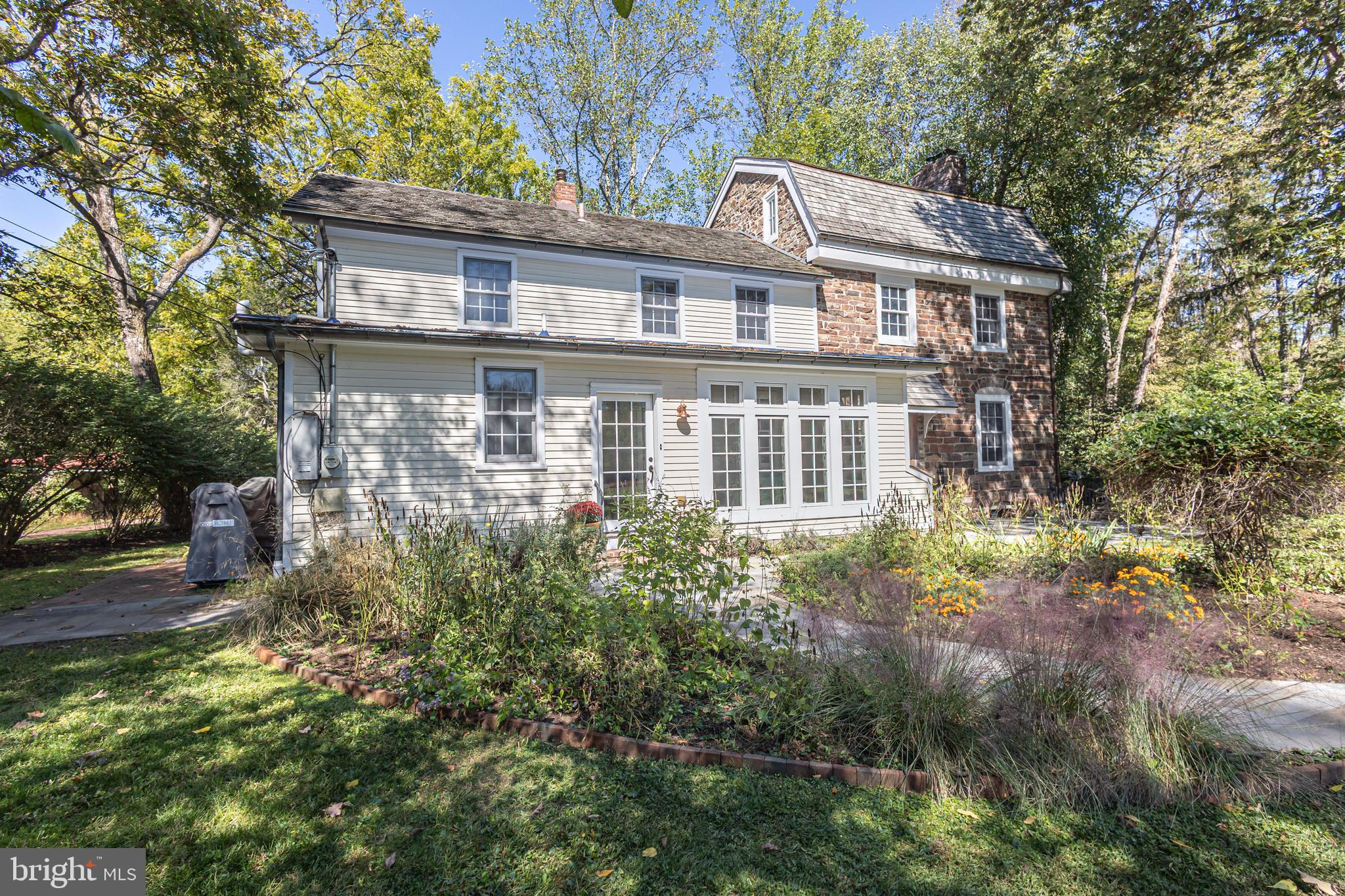 928 Taylorsville Road Washington Crossing, PA 18977 - Photo 14 of 106 front view of a house with a garden