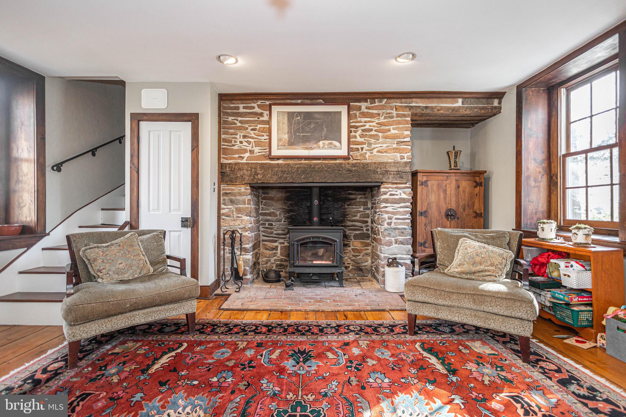 928 Taylorsville Road Washington Crossing, PA 18977 - Photo 18 of 106 a living room with furniture and a fireplace