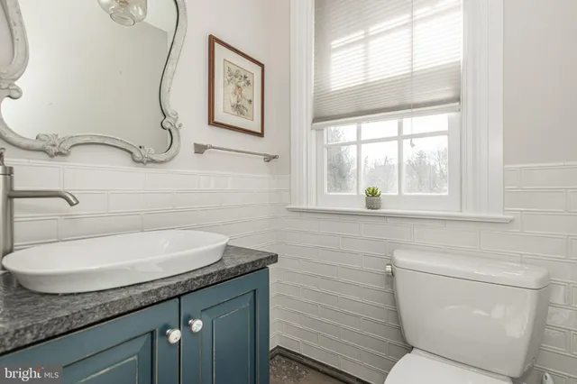 a kitchen with granite countertop a stove and a sink