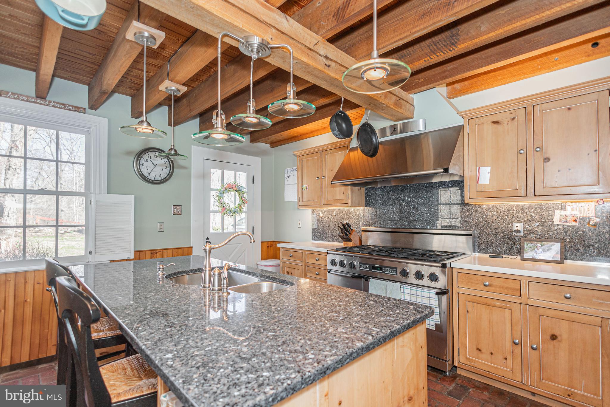 928 Taylorsville Road Washington Crossing, PA 18977 - Photo 23 of 106 a kitchen with stainless steel appliances granite countertop a sink a stove and cabinets