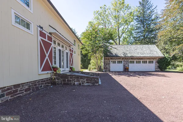 a view of a house with a yard and sitting area