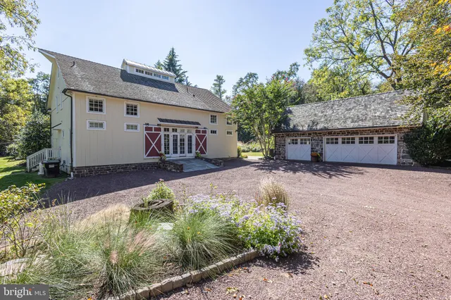 a view of a patio with table and chairs under an umbrella