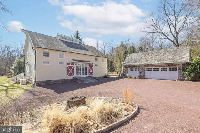 a view of a swimming pool with a yard and sitting space