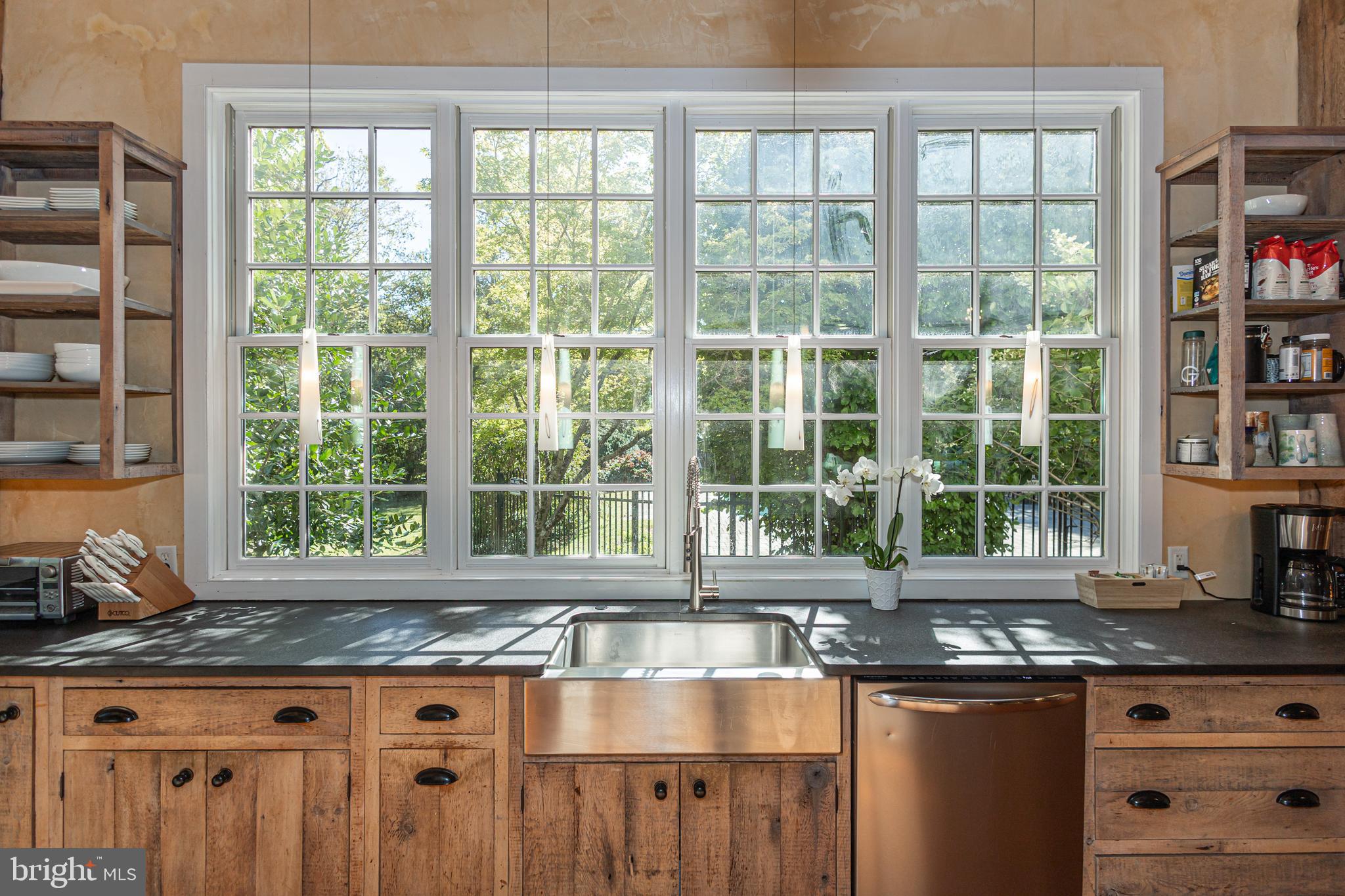 928 Taylorsville Road Washington Crossing, PA 18977 - Photo 40 of 106 a kitchen with granite countertop a stove and a sink