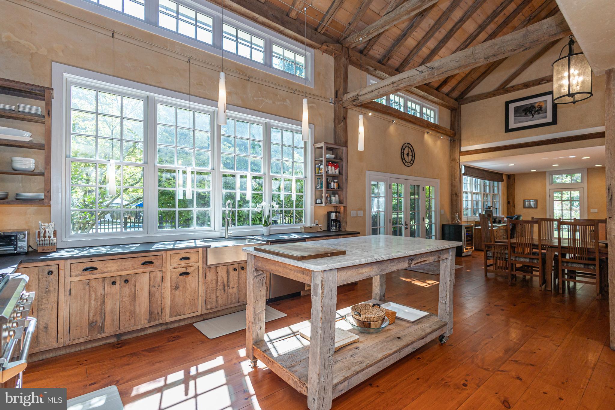928 Taylorsville Road Washington Crossing, PA 18977 - Photo 41 of 106 a open kitchen with stainless steel appliances granite countertop a stove and cabinets